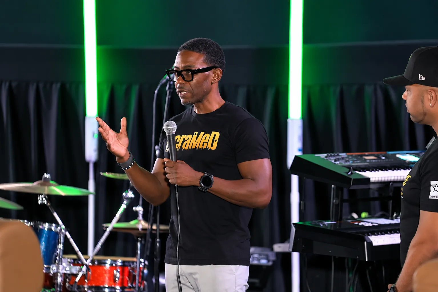 DeMarco Campbell, founder of OcraMeD, speaking on stage
